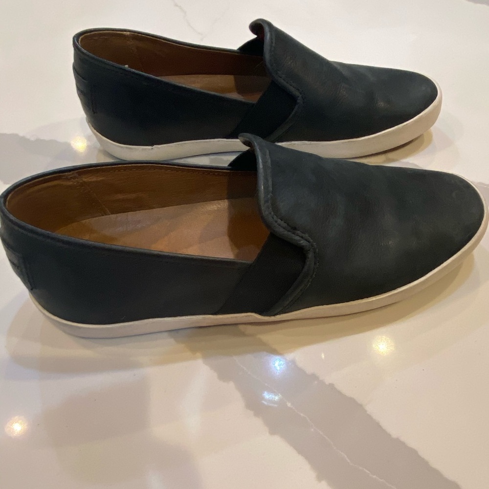 Women’s Black leather Frye sneakers.